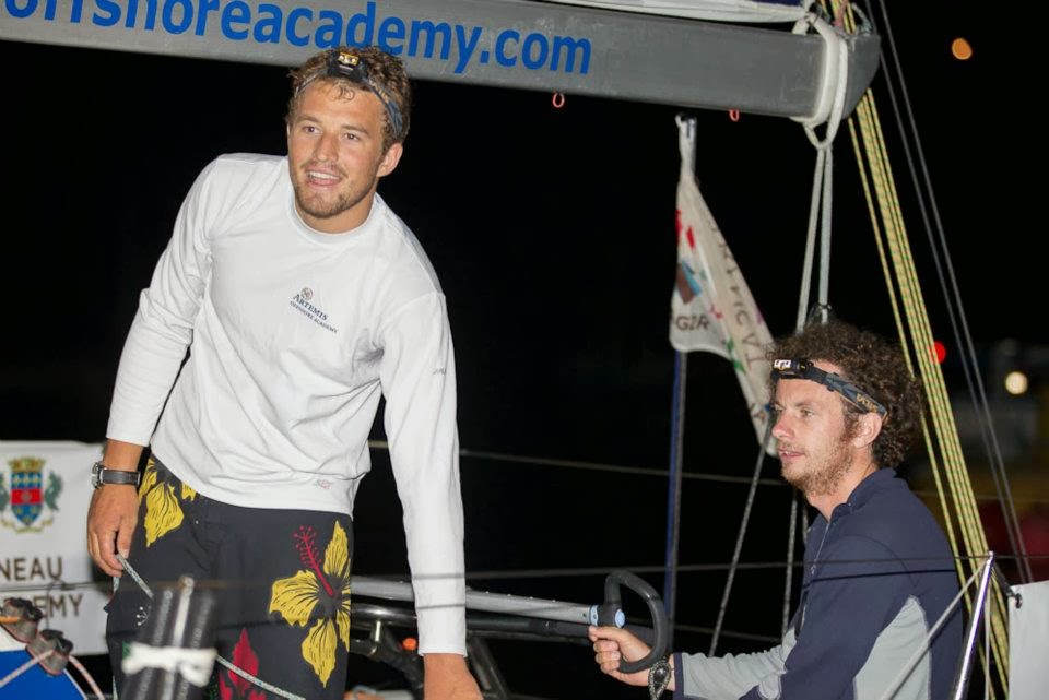 nick sailing a yacht at night